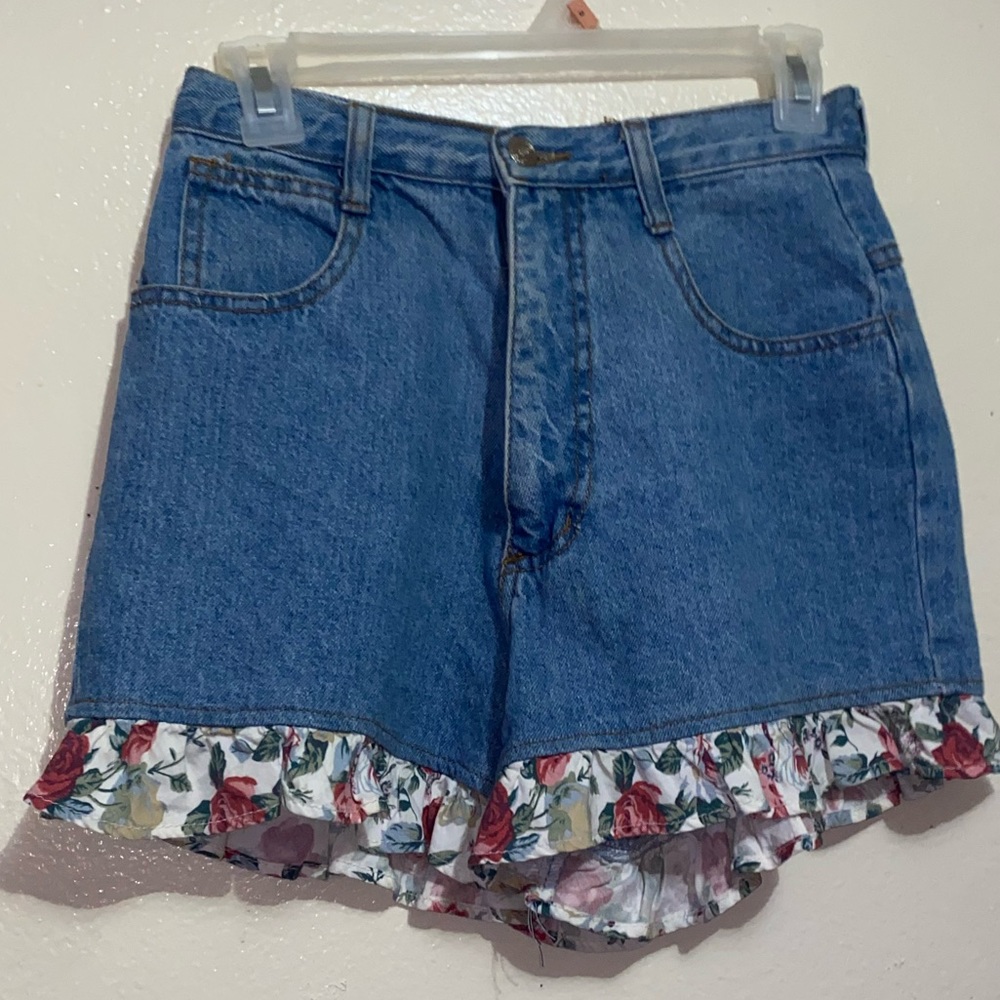 Denim shorts with floral ruffles details